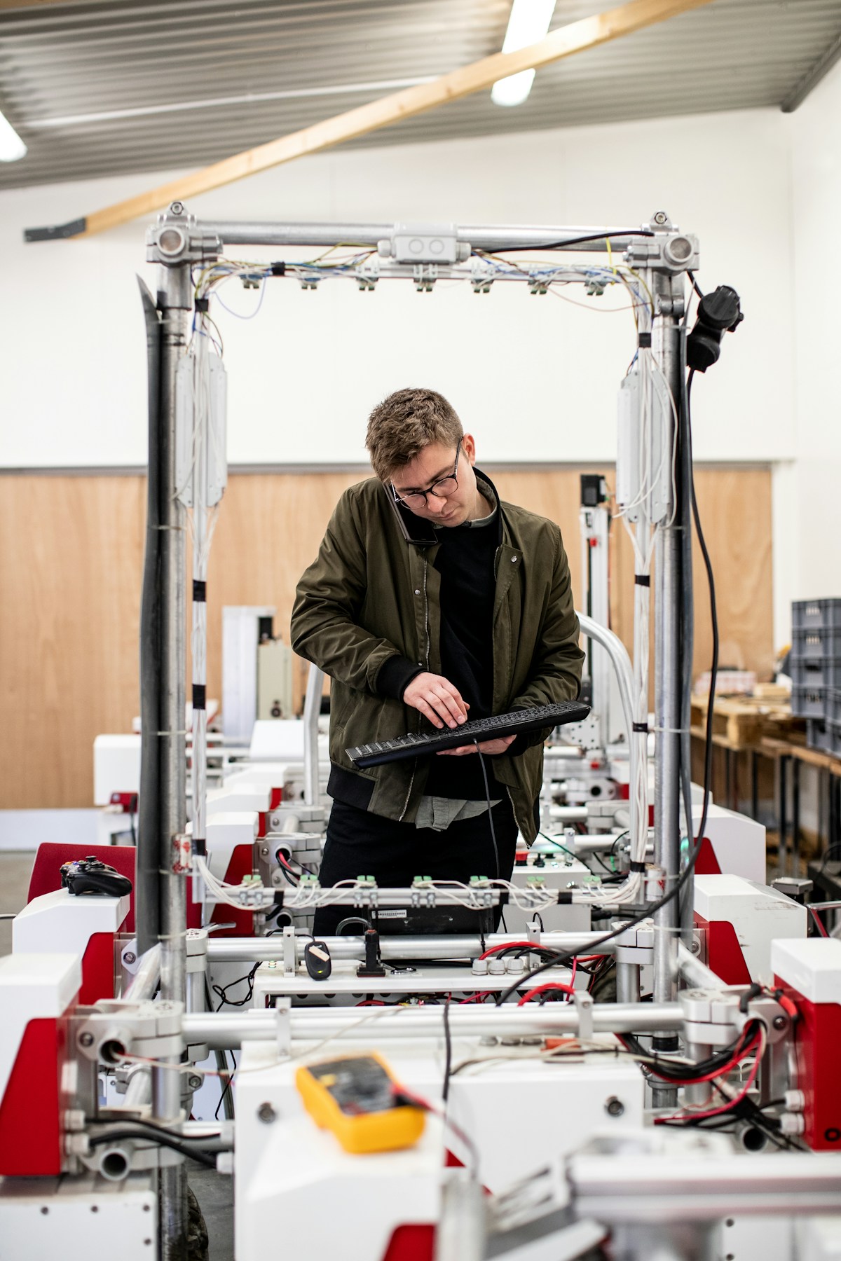 Engineer working on industrial automation line in PCB factory